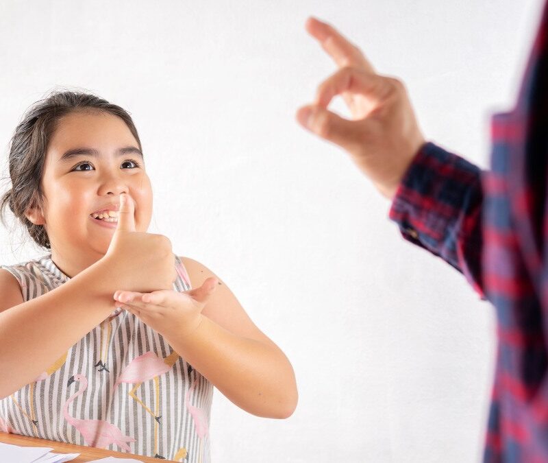 is talking with your hands a sign of autism