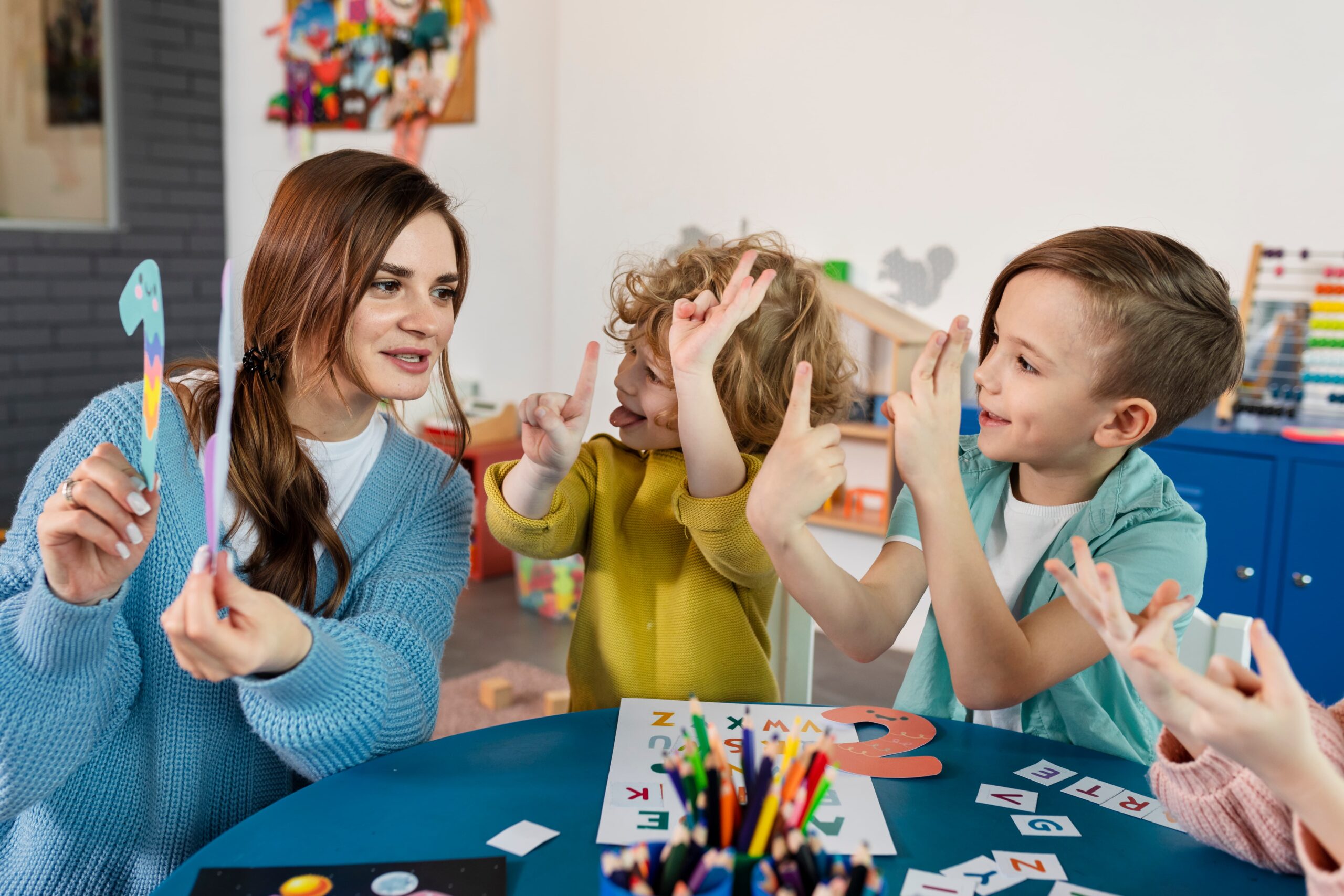 medium shot kids teacher table 1 scaled