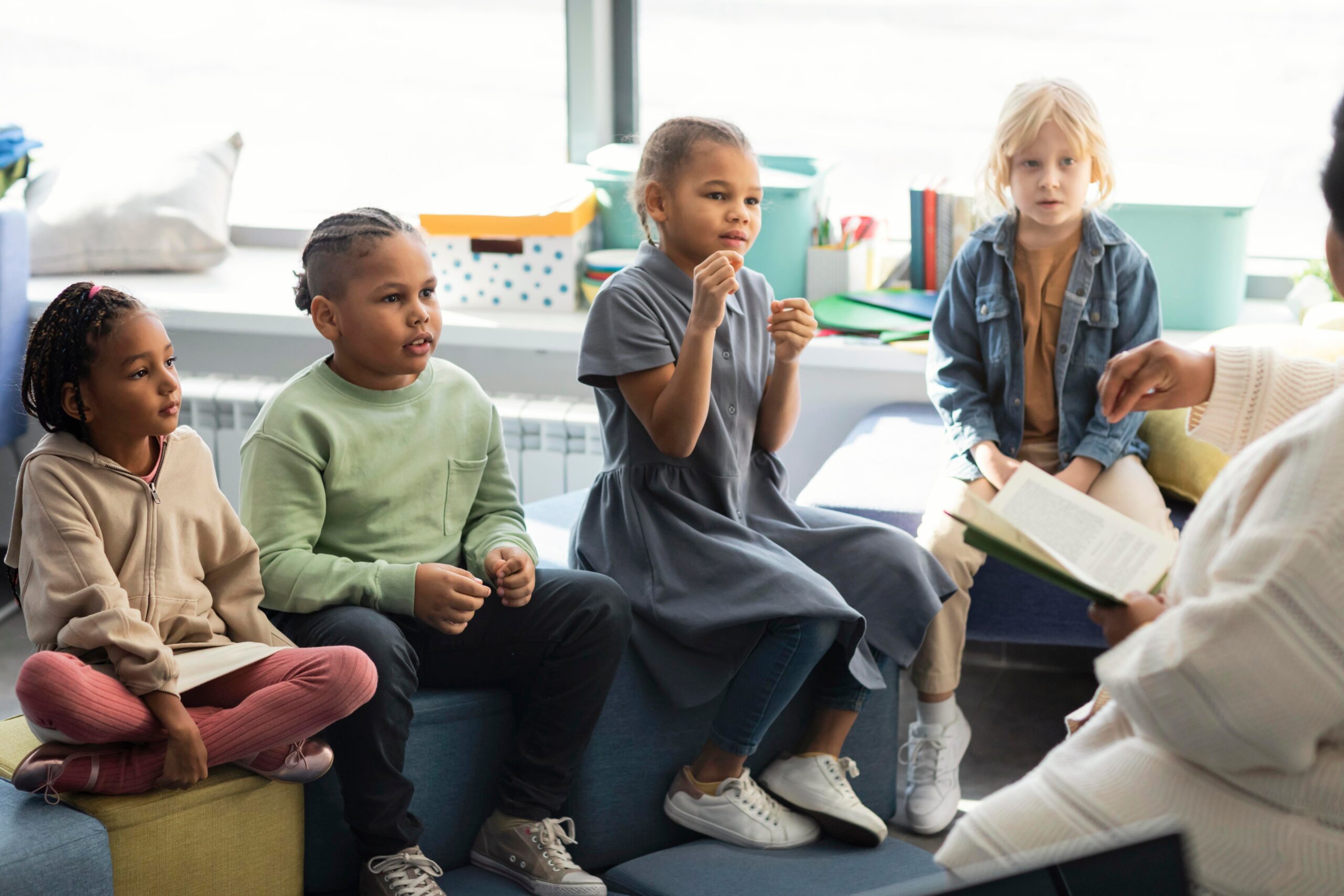 female teacher reading her pupils 1 scaled
