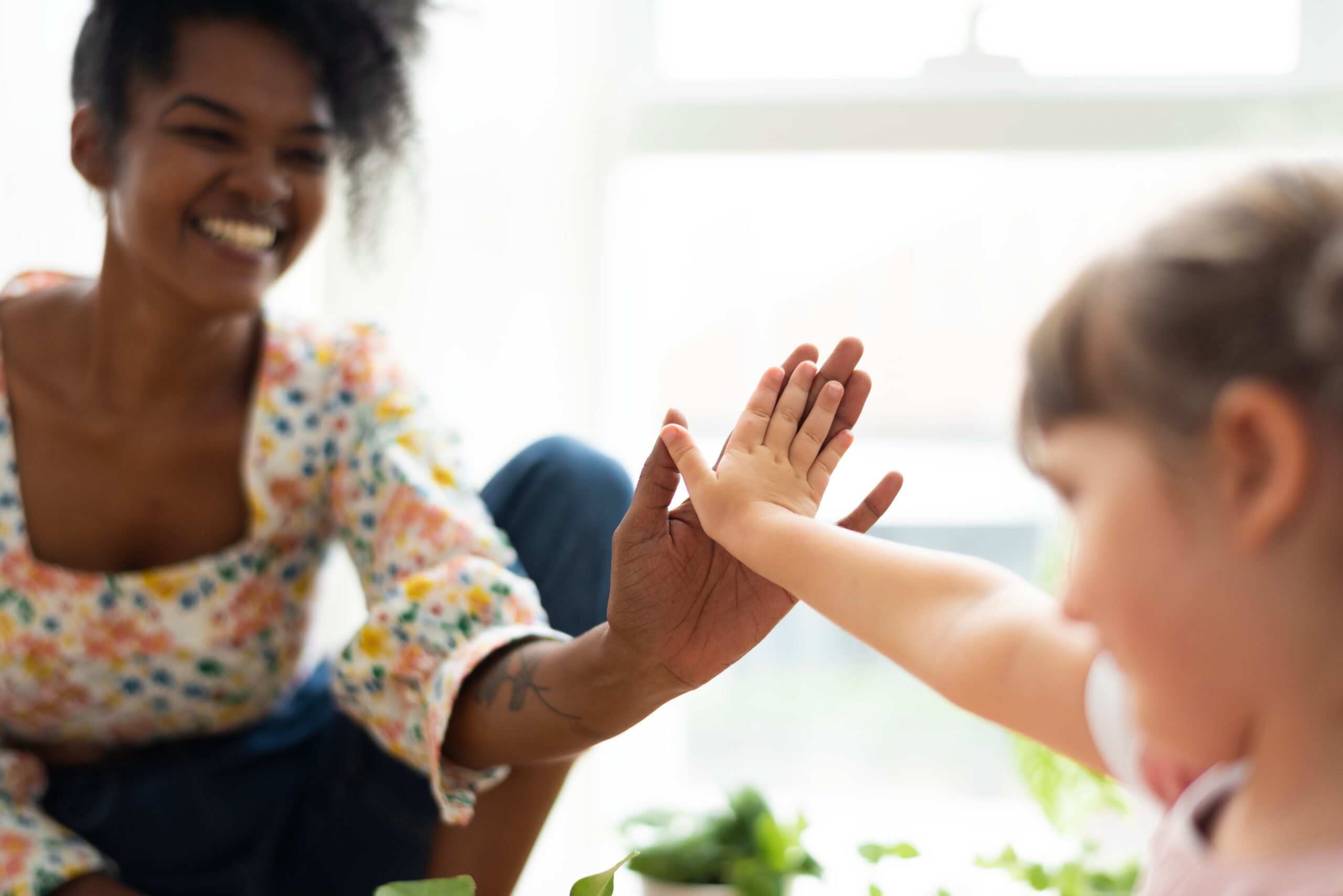 multiracial family home doing high five 1 scaled