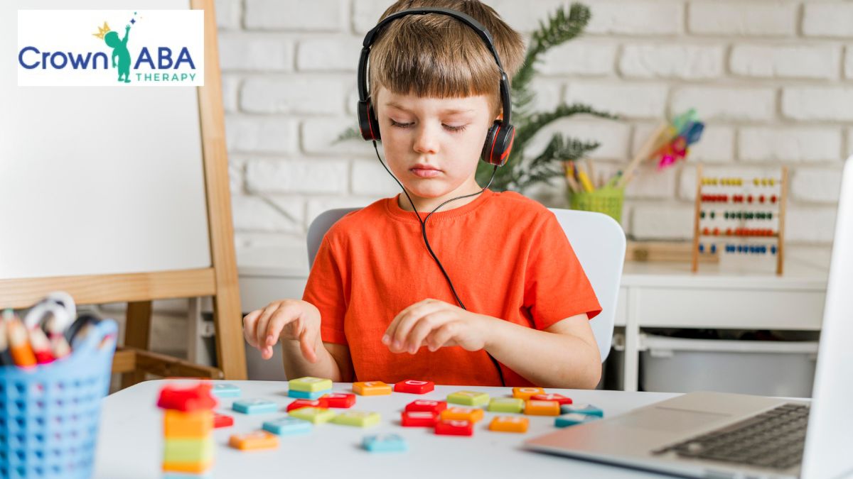 Early intervention autism: a young boy completes a puzzle task in a home office setting.