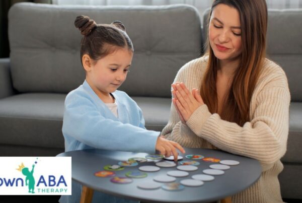 A therapist supports a young child during in-home play therapy to build social skills in the living room.