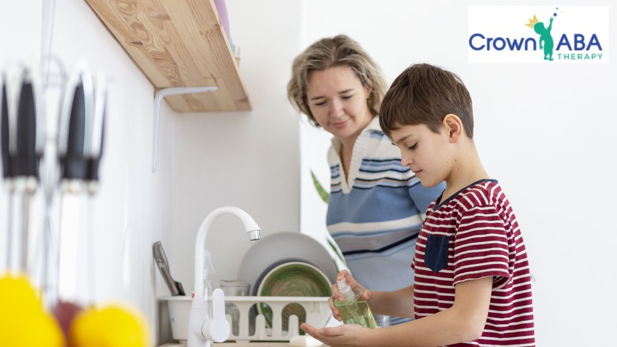 ABA therapy in Maryland: a young child completes kitchen chores while a parent looks on.